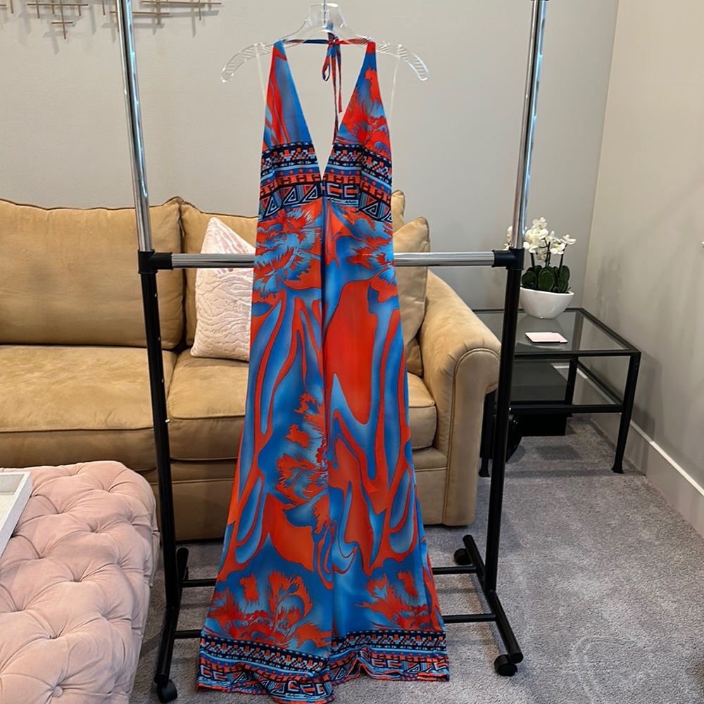 Resort Wear Romper in small! Excellent condition. Halter style top. Zip up back.